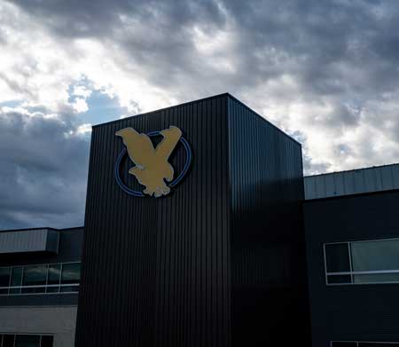 Drone photo of the Clay Pathfinder building with the LCCC logo on it.