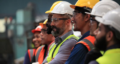 Photo of a line of construction workers