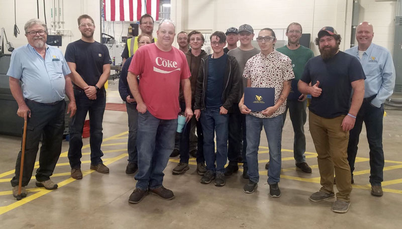 photo of the first round of students to complete the CNC Bootcamp Class standing in the AMMC space