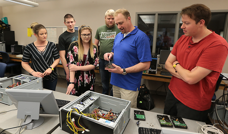 computer science student and faculty in class